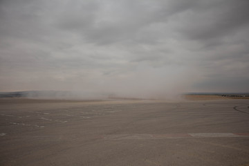 Cars on the race track and on the roads of the desert