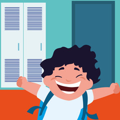 little schoolboy with schoolbag in school corridor