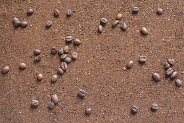 Coffee selected and ground with grain for background and greeting card with place for inscription 