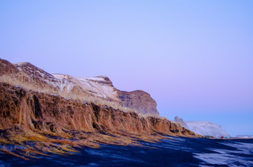 Fototapeta na wymiar Vik Beaches in Iceland, with cliffs and mountains in view