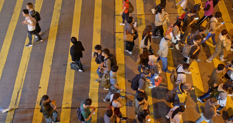 Top view of people cross the road in Hong Kong at night