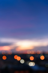 Defocused cityscape or city view with sweet pastel color sky and bokeh at sunset