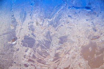 An icy, frost background image.  In this image, you can see the unique patterns created when frost forms on glass.