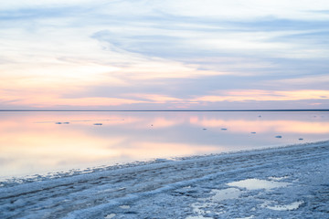 Fototapeta na wymiar Salt lake. Evening sunset with beautiful sky and water.