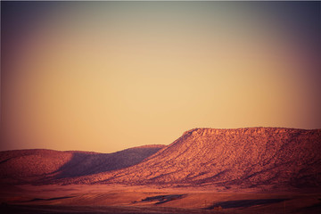 The high, open desert of Arizona with mountains in the distance.