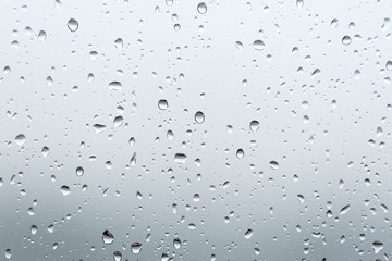 Close up raindrops on the window with blur background