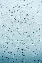 Close up raindrops on the window with blur background