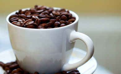 Fried coffee beans close-up - excellent morning breakfast. Black Espresso.