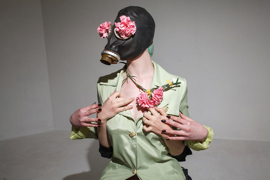 Funny fetish girl wearing gas mask. Crazy playful gonzo concept