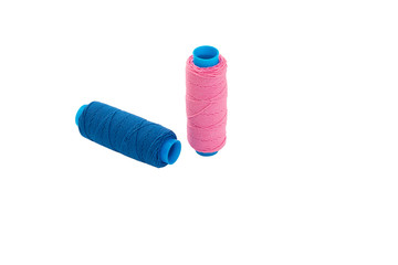 Two thread bobbin isolated on a white background