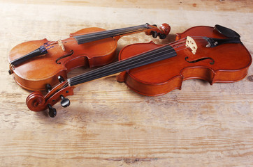 Fototapeta na wymiar Two violins on a wooden table