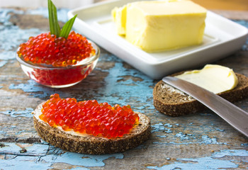 red caviar on black bread with butter. Healthy food. Fish appetizer.