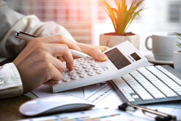 Women's hands with items for business on the table