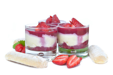 delicious straberry tiramisu  in glass and biscuit on white background