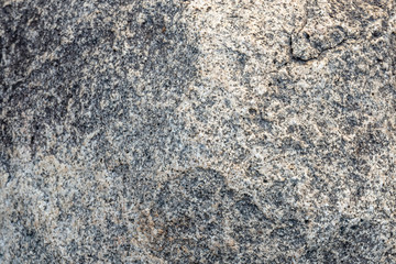 Close up natural rock stone texture in gray and white color use for wallpaper, background or decoration printables.