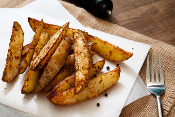 Baked potato wedges - homemade organic vegetable, vegan potato wedges snack