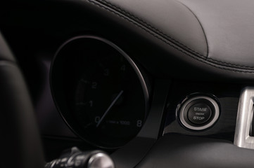 Fototapeta na wymiar Car engine start stop button. Interior detail.