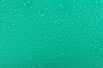 ガラスに付いた水滴 背景緑