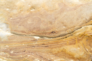 Close up rugged marble texture detailed of natural yellow rock sandstone background.