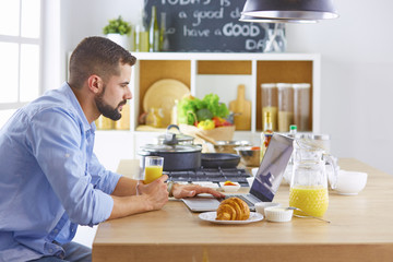 a business man breakfasts with notebook and juice