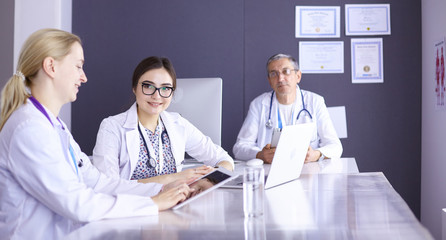 Doctors having a medical discussion in a meeting room