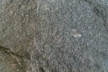 Dark grey tone color natural rock, stone texture background.