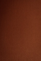 Brown-golden texture with gradient, background, abstraction. Space for text. Matte coating