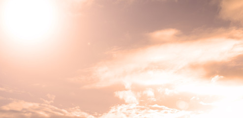 Fabulous sunset on a blue sky with white clouds. Background, texture.