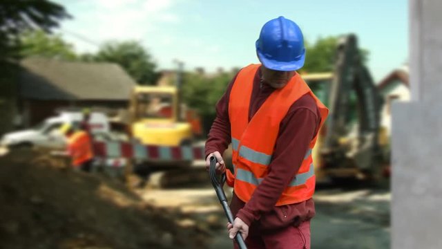 Dangerous situation on a construction site. Worker escaping an accident.