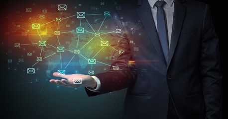 Elegant businessman holding communication concept on his hand 