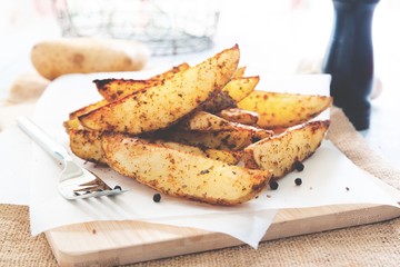 Baked potato wedges - homemade organic vegetable, vegan potato wedges snack