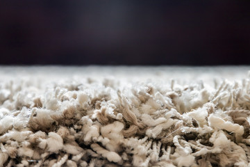 carpet high pile of threads of different thickness and weaving. Shaggy carpet  