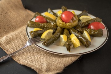 traditional Turkish dishes with olive oil leaves and stuffed peppers