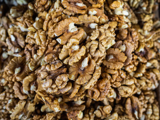 Set of the peeled walnuts on a counter of shop. Useful and healthy nutrition