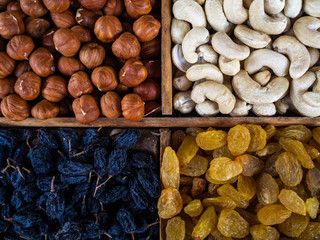 Nuts and raisin on a counter of shop. Filbert, cashew and dry grapes. Useful products