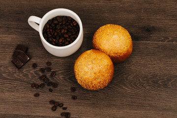 cup of coffee with bread   on wooden table