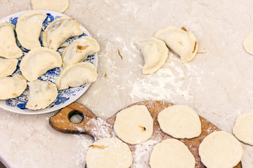 Preparing, cooking, making homemade dumplings with cabbage.