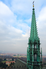 Tower of Gothic St. Vitus Cathedral on background of city, Prague, Czech Republic