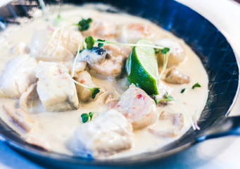 Seafood cream saute with lime in pan in restaurant.