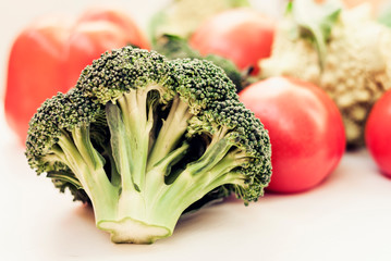 Vegetable variety on wooden white table. Selection of summer and autumn vegetables, space for text.