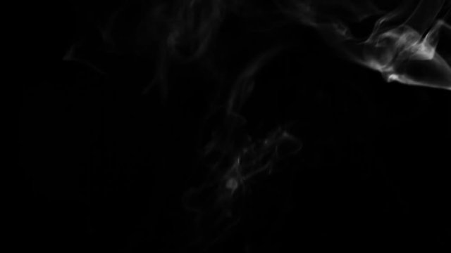 Dynamic smoke motion on a dark black background for video design