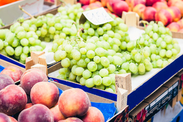 various colorful fresh fruits and vegetables in the fruit market, Catania, Sicily, Italy.
