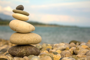 Yellow Pebble Pyramid by the Ocean