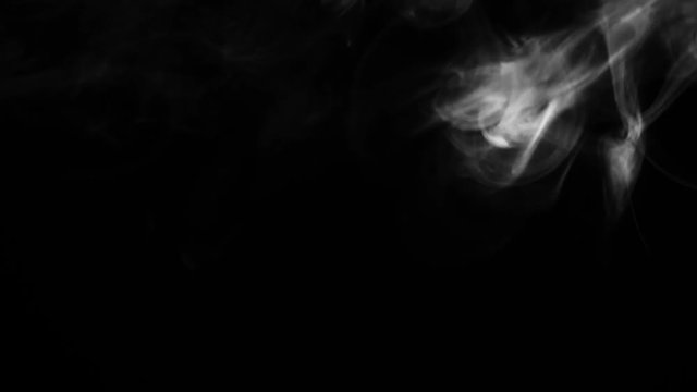 Dynamic smoke motion on a dark black background for video design
