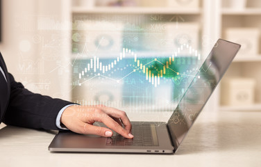 Business woman in homey environment using laptop with global financial report concept
