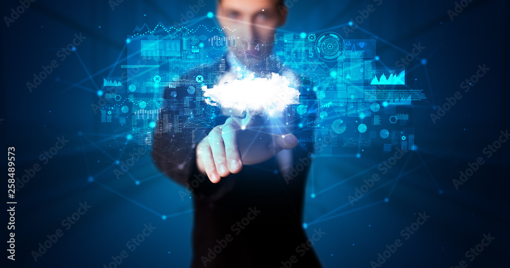 Aufkleber Man touching hologram projection displaying information from cloud based system
