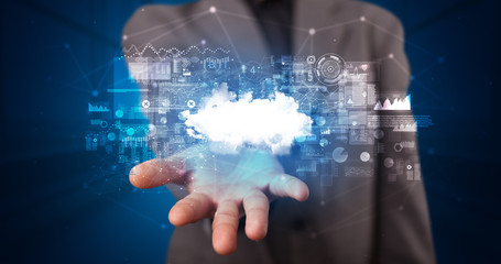 Person holding hologram screen displaying information from cloud based system
