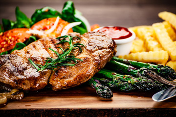 Grilled steak with french fries and vegetables