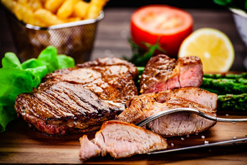 Grilled steak with french fries and vegetables