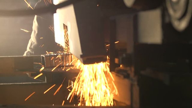 Many square and rectangular metallic billets lying on a flat machine tool